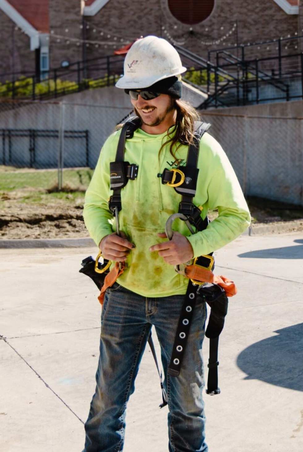 Wendler worker smiles as he surveys a worksite